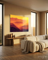 Amber Ridges glass wall art displayed above a wood console in a warm beige minimalist living room with bouclé sofa