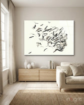 Bird Thoughts glass wall art displayed above a wood credenza in a warm beige minimalist living room with linen sofa