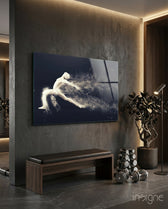 Particle Dance glass wall art displayed above a wood bench in a dark concrete-walled gym with dumbbells