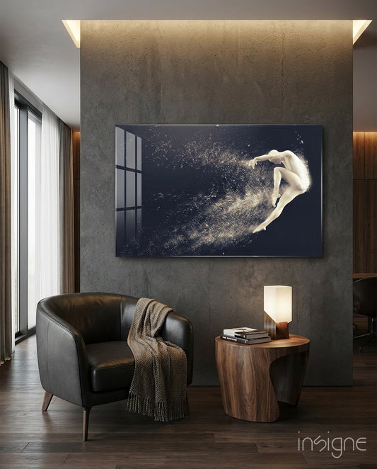 Spirit Leap glass wall art displayed above a walnut side-table in a dark concrete-walled lounge with charcoal leather chair