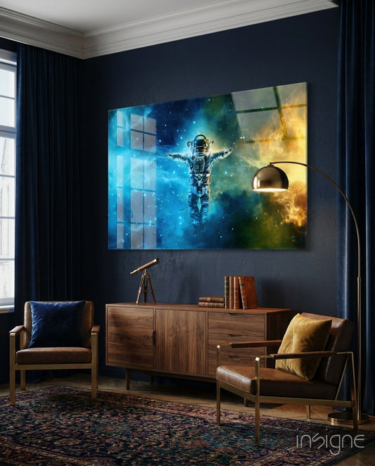 Nebula Astronaut glass wall art displayed above a walnut credenza in a dark navy library lounge with brown leather chairs