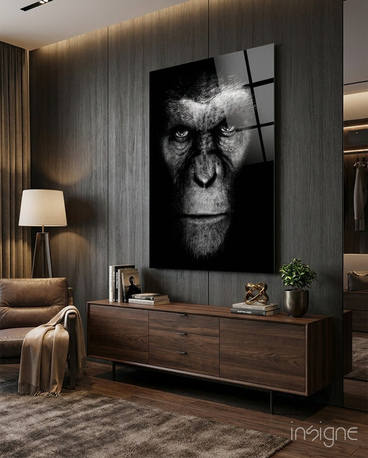 Chimp Gaze glass wall art displayed above a walnut credenza in a dark luxe wood-paneled lounge with cognac chair