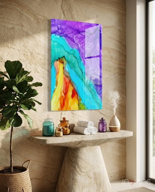 Rainbow Cascade glass wall art displayed above a stone console in a warm sandstone-walled spa bathroom
