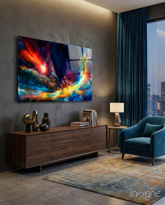 Cosmic Aurora glass wall art displayed above a walnut credenza in a dark grey lounge with teal velvet armchair and city view
