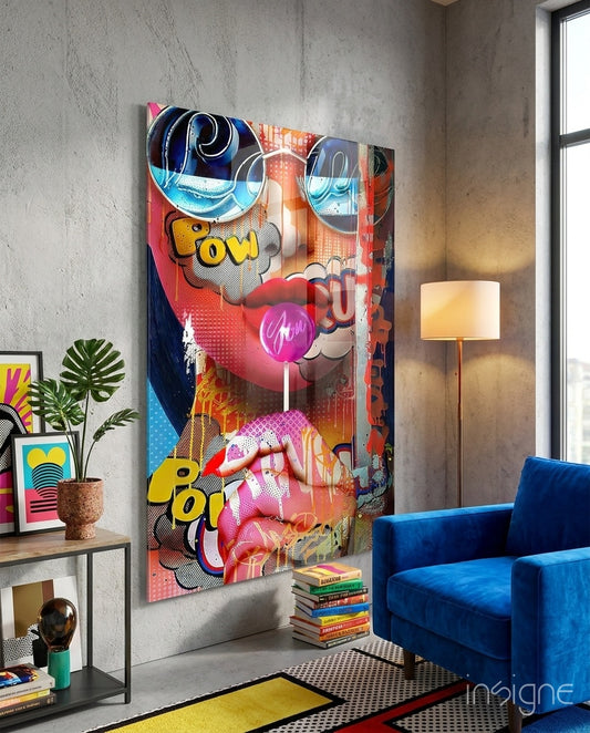 Bubblegum Pop glass wall art displayed above a wood console in an industrial concrete-walled lounge with cobalt velvet armchair