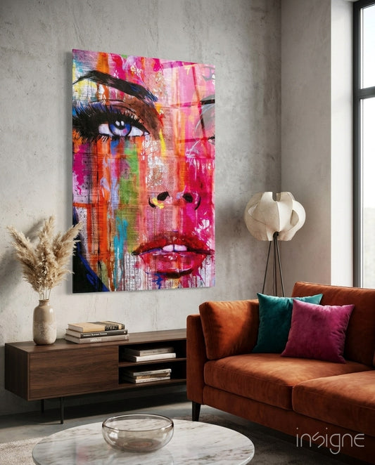 Newspaper Pop glass wall art displayed above a wood credenza in a warm minimalist concrete-walled lounge with rust velvet sofa