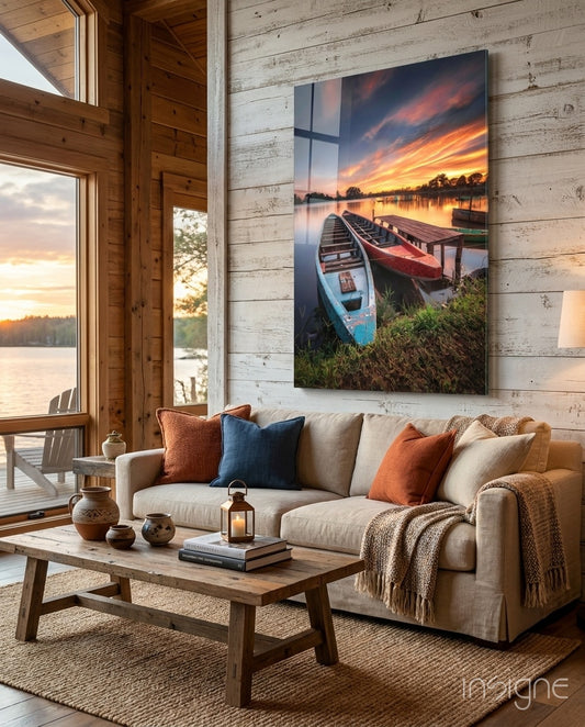 Lakeside Boats glass wall art displayed above a linen sofa in a rustic whitewashed cabin lounge with terracotta cushions