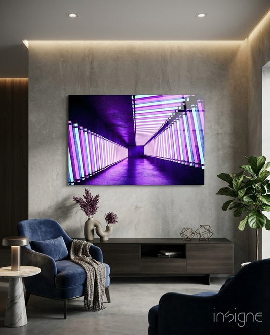 Neon glass wall art displayed above a dark wood credenza in a cool concrete-walled lounge with navy velvet armchair