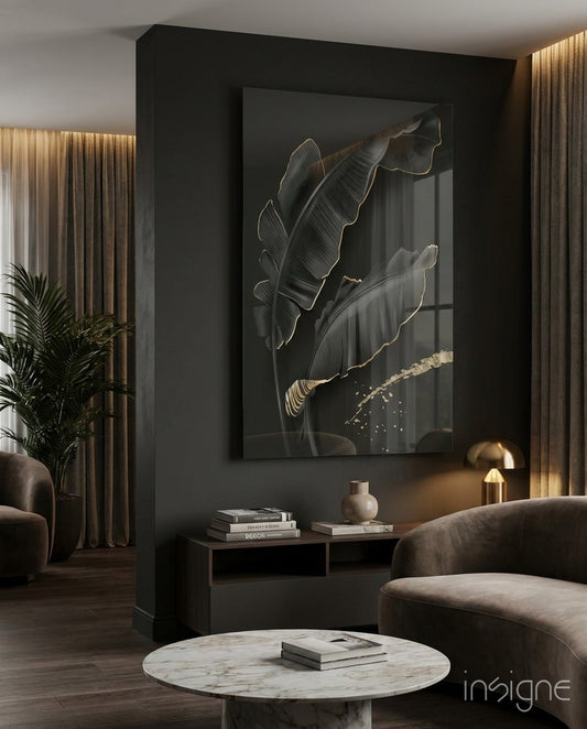 Leaf glass wall art displayed above a dark console in a moody charcoal-walled lounge with bronze pendant
