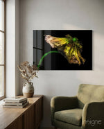 Flower glass wall art displayed above a wood console in a soft white-walled lounge with sage velvet armchair and dried botanicals