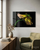 Flower glass wall art displayed above a wood console in a soft white-walled lounge with sage velvet armchair and dried botanicals