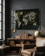 Modern World Map glass wall art displayed above a wood library shelf in a black brick-walled study with brass lamp and antique globe
