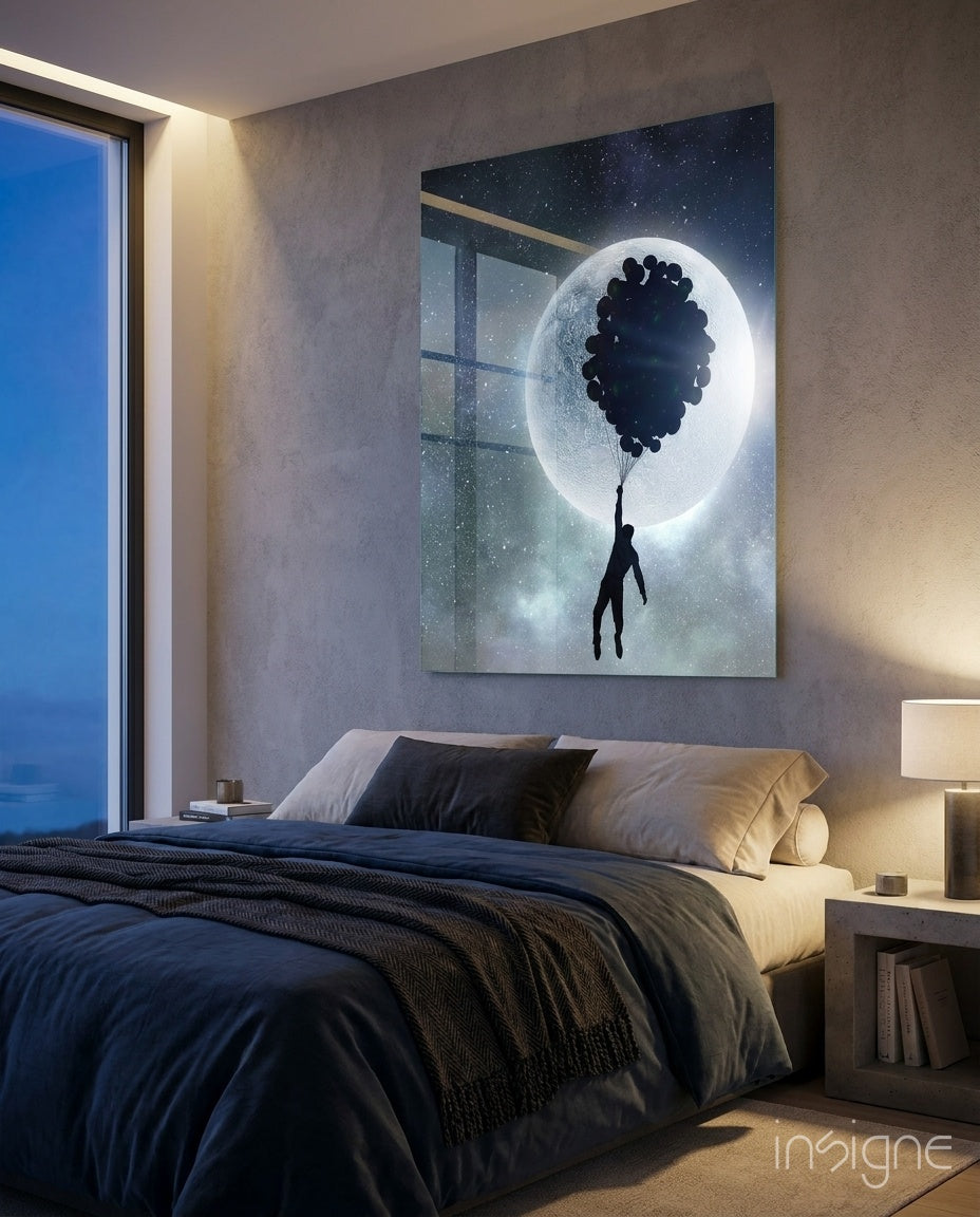 Hot Air Balloons glass wall art displayed above a navy linen bed in a soft concrete-walled bedroom with oceanview window