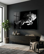 Horse glass wall art displayed above a dark wood credenza in a moody charcoal-walled lounge with leather armchair and fiddle leaf fig