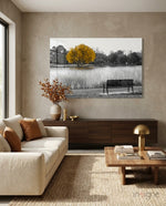 Yellow Tree glass wall art displayed above a walnut credenza in a soft beige-walled lounge with cream sofa and copper-leaf vase