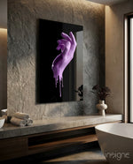Hand glass wall art displayed above a stone vanity in a moody travertine-walled bathroom with freestanding tub