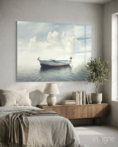 Marine glass wall art displayed above a wood credenza in a soft white-walled bedroom with linen bedding and olive tree