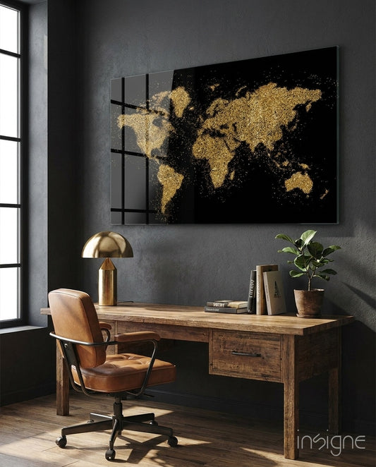 World Map glass wall art displayed above a rustic wood desk in a moody charcoal-walled office with cognac leather chair and brass lamp