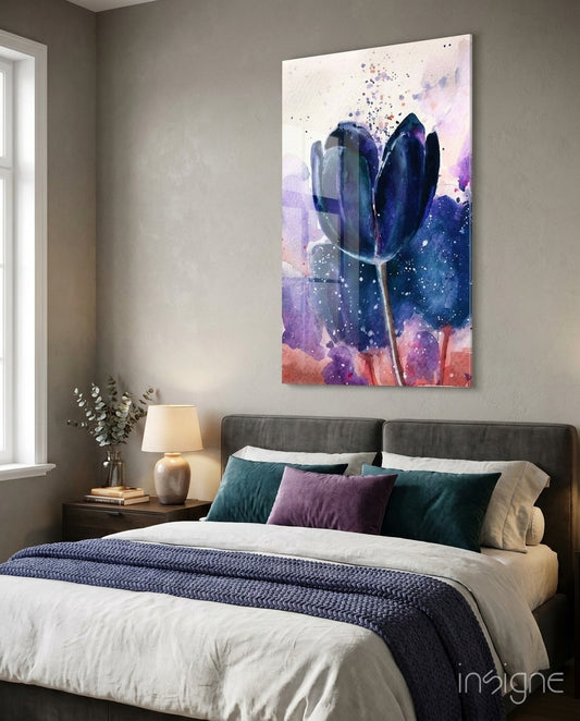 Tulip glass wall art displayed above a charcoal upholstered bed in a soft taupe-walled bedroom with violet velvet pillows