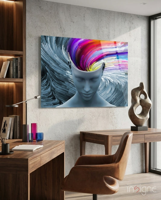 Color of Gray glass wall art displayed above a walnut desk in a concrete-walled office with cognac chair and wood bookshelf