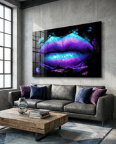 Lip glass wall art displayed above a gray leather sofa in a concrete-walled lounge with violet velvet pillows and reclaimed wood coffee table