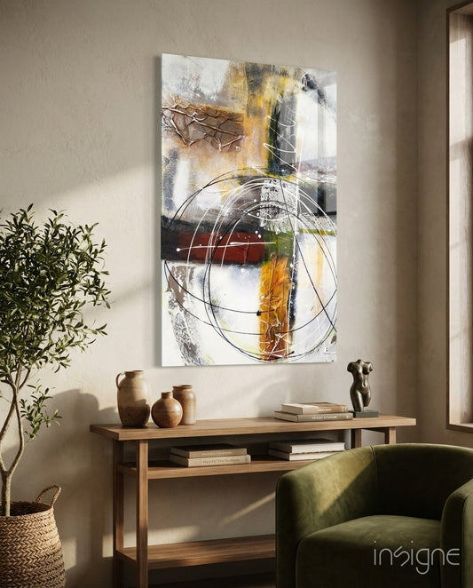 Abstract glass wall art displayed above a wood console in a soft beige-plaster hallway with olive tree and stoneware vases
