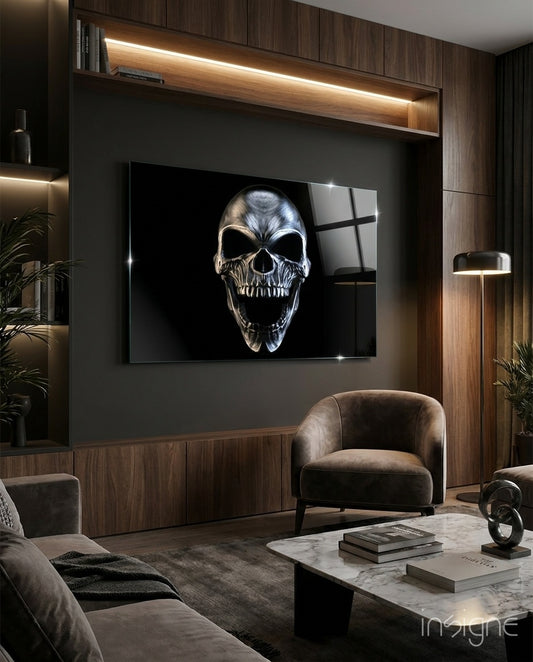 Skull glass wall art displayed above a wood TV niche in a moody walnut-paneled lounge with gray velvet sofa and marble coffee table