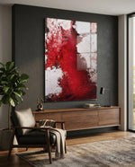 Colors of Abstraction glass wall art displayed above a walnut credenza in a moody charcoal-walled lounge with leather armchair and fiddle leaf fig