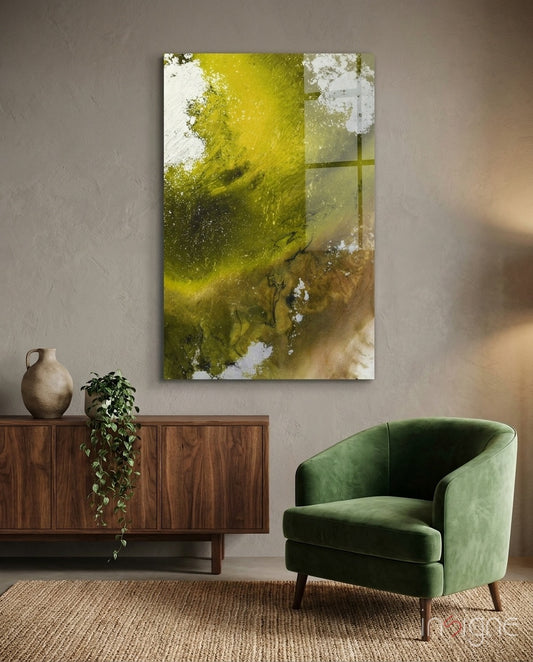 Colors of Abstraction glass wall art displayed beside a green velvet armchair in a soft taupe-walled lounge with walnut credenza and trailing pothos