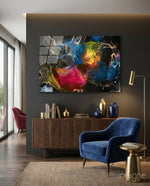 Energy glass wall art displayed above a walnut credenza in a moody charcoal-walled lounge with navy velvet armchair and brass lamp