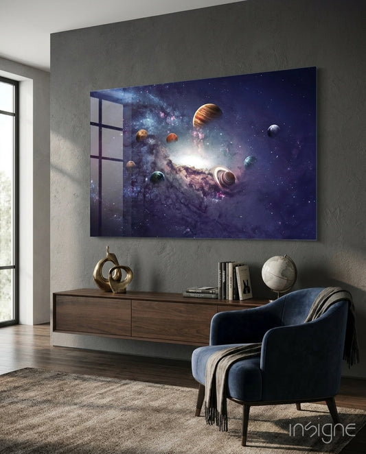 Planets glass wall art displayed above a walnut credenza in a charcoal-walled lounge with navy velvet armchair and antique globe