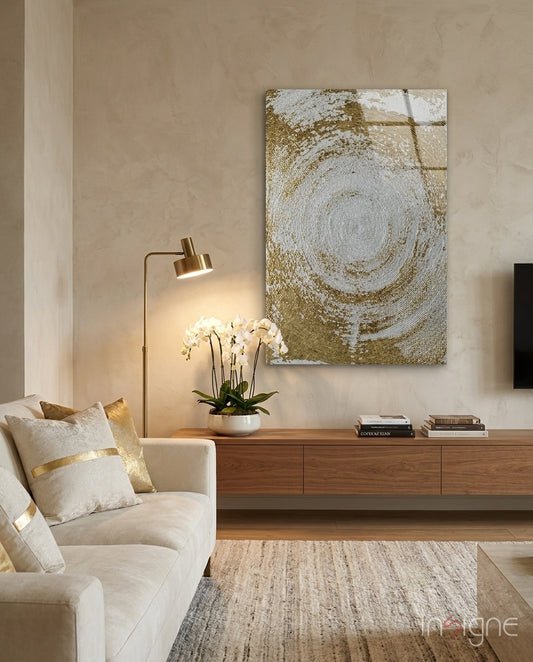 Abstract Loop glass wall art displayed above a walnut credenza in a soft sand-plaster lounge with cream sofa and orchid arrangement