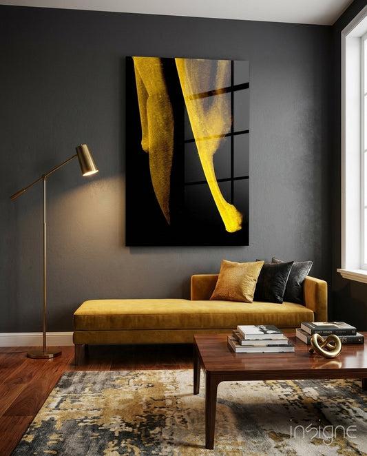 Yellow Story glass wall art displayed above a saffron velvet daybed in a charcoal-walled lounge with brass floor lamp and walnut coffee table