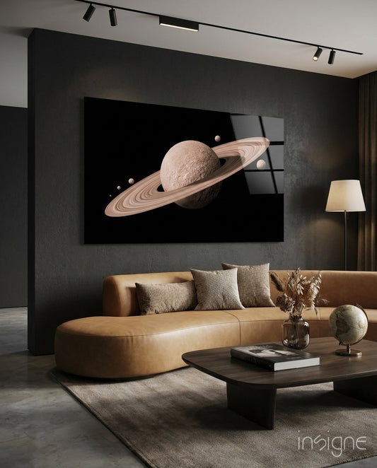 Saturn glass wall art displayed above a tan leather curved sofa in a moody charcoal-walled lounge with low coffee table and antique globe