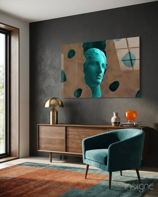 Sculpture glass wall art displayed above a walnut credenza in a charcoal-walled lounge with teal velvet armchair and amber glass vase