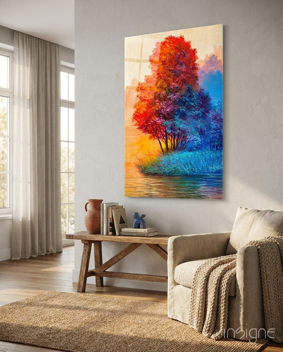 Red Tree glass wall art displayed above a wood console in a soft white-plaster lounge with linen armchair and terracotta jug