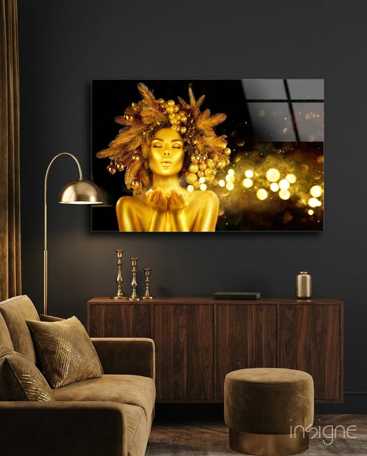 Gold Woman glass wall art displayed above a walnut credenza in a moody charcoal-walled lounge with brass candlesticks and gold velvet sofa