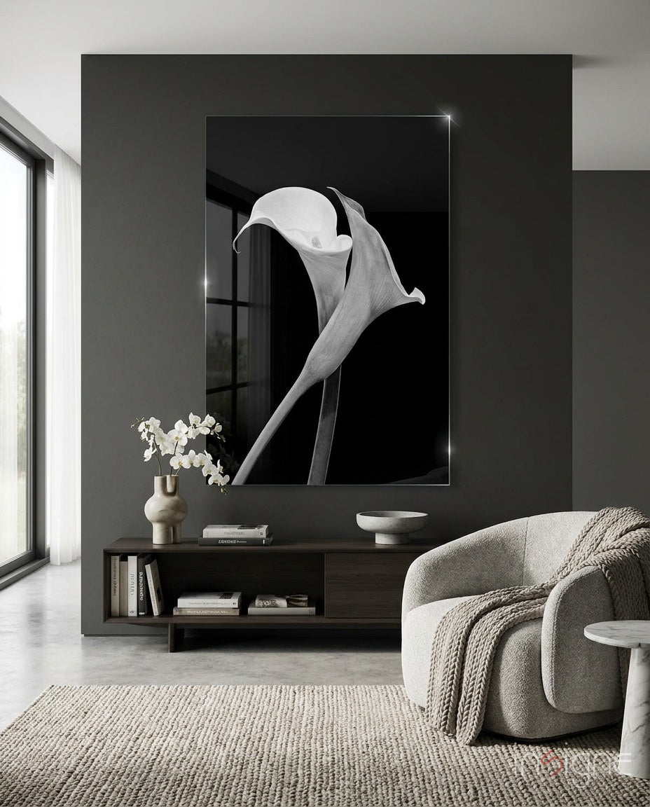 Flower glass wall art displayed above a dark wood credenza in a moody charcoal-walled lounge with bouclé swivel chair and orchid arrangement