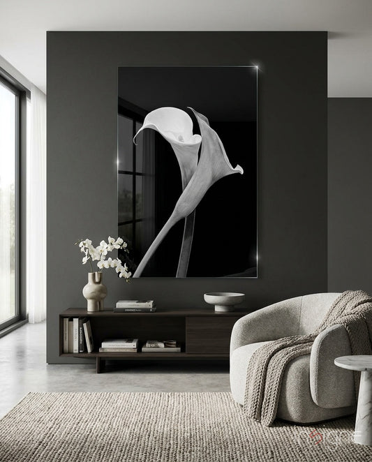 Flower glass wall art displayed above a dark wood credenza in a moody charcoal-walled lounge with bouclé swivel chair and orchid arrangement