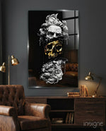 Poseidon glass wall art displayed above a walnut credenza in a moody charcoal-walled lounge with cognac Chesterfield and brass desk lamps