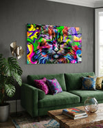 Cat glass wall art displayed above a green velvet sofa in a charcoal-walled lounge with patterned pillows and reclaimed wood coffee table
