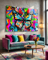 Butterfly glass wall art displayed above a teal velvet sofa in a soft concrete-walled lounge with magenta velvet pillows and round wood coffee table