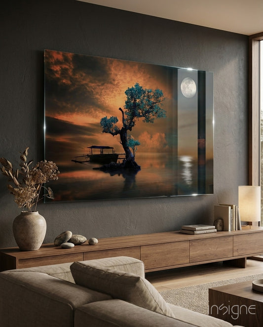 Night of the Tree glass wall art displayed above a wood TV credenza in a moody charcoal-walled lounge with linen sofa and stoneware vase