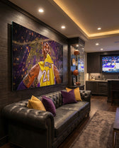 Kobe Bryant glass wall art displayed above a black tufted leather sofa in a man cave with basketball shelf and brushed-brass sconces
