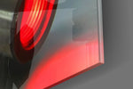Light Saber artwork anchoring a wall with moody dramatic palette