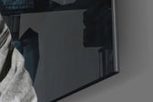 Tupac Shakur artwork anchoring a wall with moody dramatic palette
