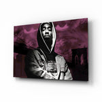 Tupac Shakur glass wall art displayed above a black leather sectional in a moody music room with reclaimed-wood console and brass arc lamp