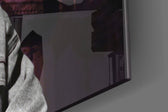 Tupac Shakur artwork anchoring a wall with bold moody palette