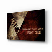 Fight Club: Rule 1 glass wall art displayed above a black leather sectional in a moody man cave with brass arc lamp and reclaimed-wood console