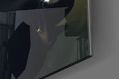 Batman artwork anchoring a wall with moody dramatic palette